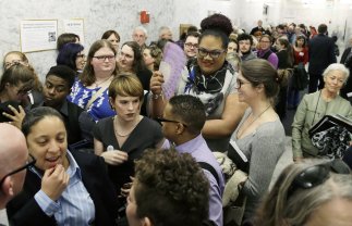 People pack a hallway outside a Washington Senate hearing room, Wednesday, Jan. 27, 2016, at the Capitol in Olympia, Wash., as they wait to listen to public testimony regarding a bill that would eliminate Washington’s new rule allowing transgender people use gender-segregated bathrooms and locker rooms in public buildings consistent with their gender identity. (AP Photo/Ted S. Warren) WATW101